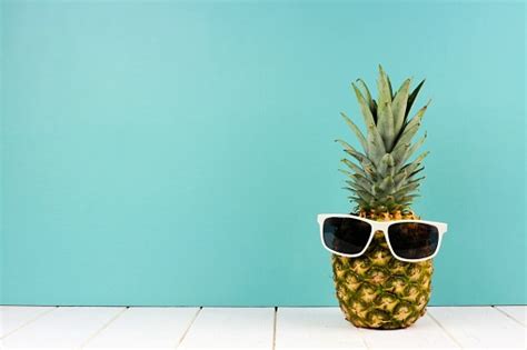 Hipster Pineapple With Sunglasses Against Turquoise Stock