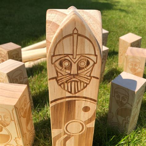 Premium Kubb Game With Burned And Carved Artwork Depicting The King And