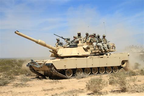 abrams soldiers ride military machine