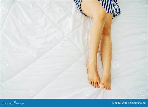 perfect and beautiful crossed woman legs and feet on bed beautiful