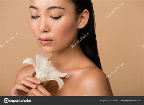Beautiful Naked Asian Girl Holding White Lily Isolated Beige Stock