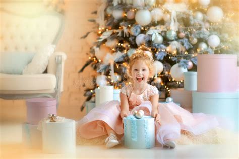 years  girl  beautiful light pink dress   blue gift box stock image image