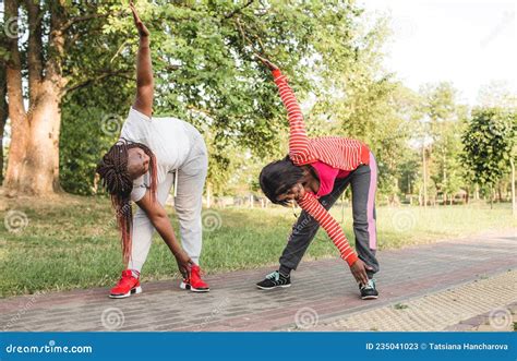 Two African American Girls Are Engaged In Sports By Performing Various