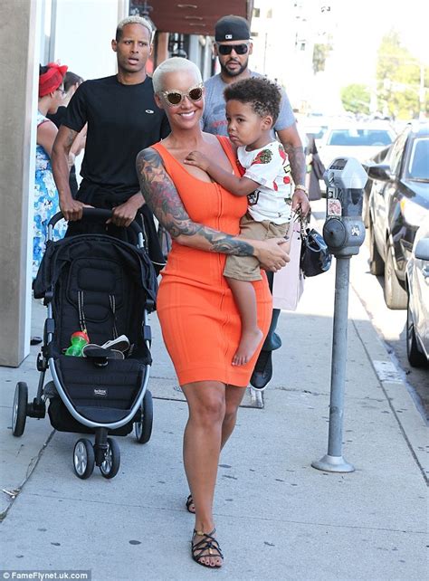 Amber Rose Squeezes Her Cleavage In Corset As She Treats Fans To A