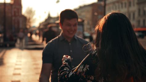 a guy meets girl walking down street gives stock footage sbv 338551213