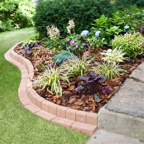 plant  curved brick flowerbed border front garden landscape