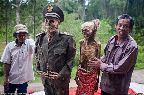 ma nene festival in indonesia sees bodies of dead relatives dug up and