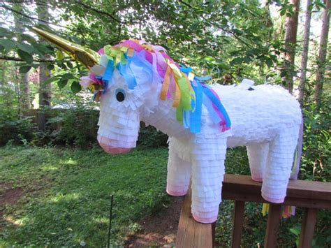 unicorn pinata rainbow mane  tail golden horn unicorn party