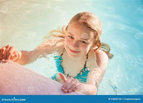 beautiful teenage blond girl swims  pool stock photo image  beauty recreation