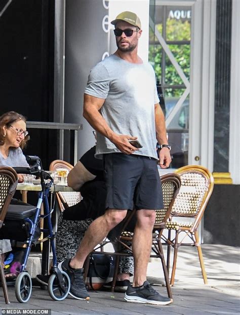 thor star chris hemsworth shows off his bulging biceps as he steps out