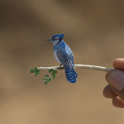 miniature birds created  paper  watercolors