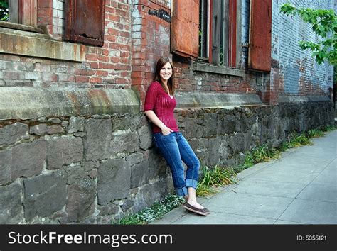 teen leaning against wall horizontal smiling free