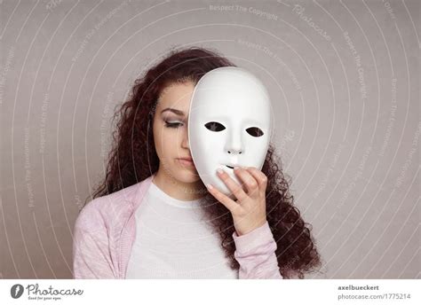 sad girl hiding face  mask  royalty  stock photo  photocase