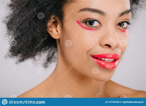 Smiling African American Woman With Red Lips And Red Paint