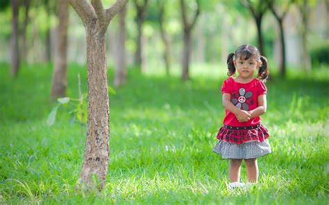 beautiful cute  girl child standing silently  garden  hd wallpapers