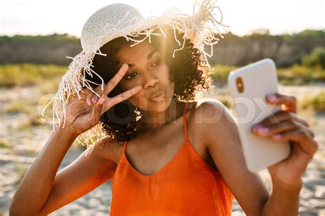 Optimistic Cheerful Young African Woman Taking A Selfie Stock Image