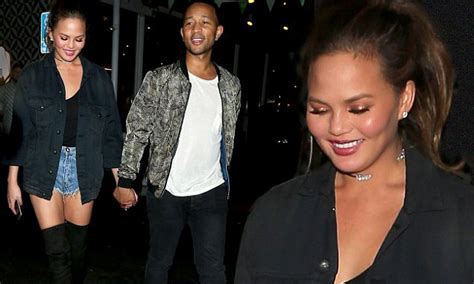 chrissy teigen steps out in thigh high boots for dinner with husband