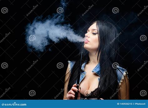 fashion girl vaping relaxing with hookah white cloud of smoke vaping