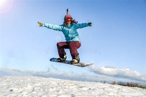 young woman   snowboard jumping stock photo image  mountain
