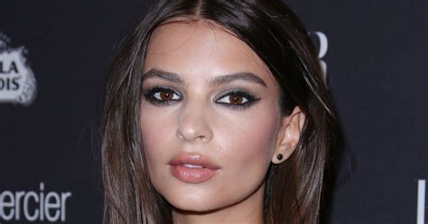 emily ratajkowski shows off her famous cleavage as she strips down to skimpy swimwear in new