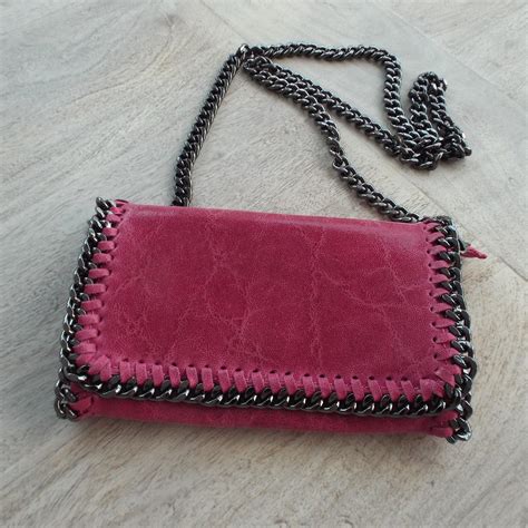 pink leather clutch bag  chain edging  detachable shoulder strap dress
