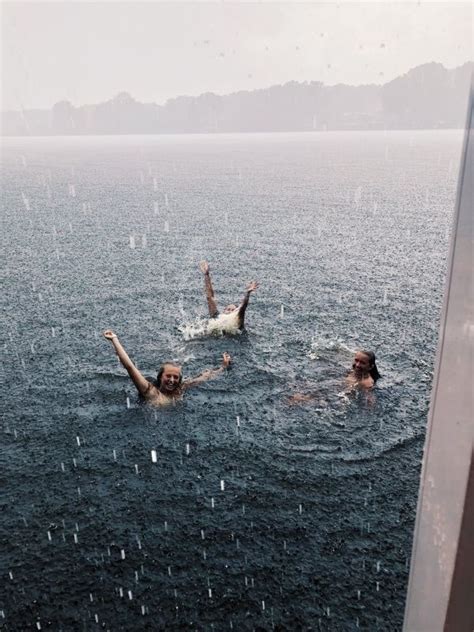 playing in the rain in the ocean summer aesthetic