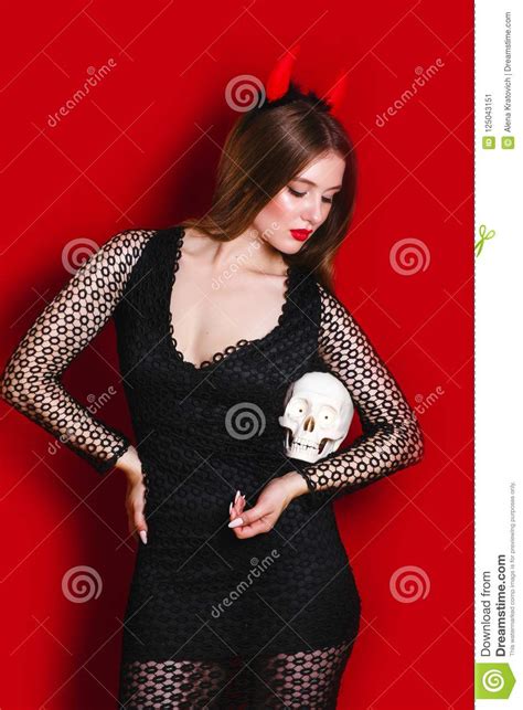 halloween woman devil on red background stock image