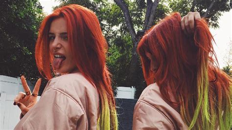 Bella Thorne Dyes Her Hair Bright Red With Yellow Tips
