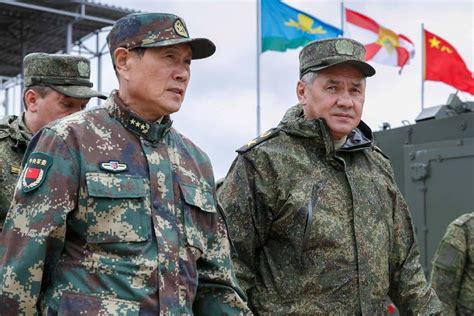 russian and chinese defense ministers inspects command