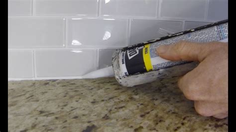 How To Install Caulk On A Kitchen Tile Backsplash Youtube