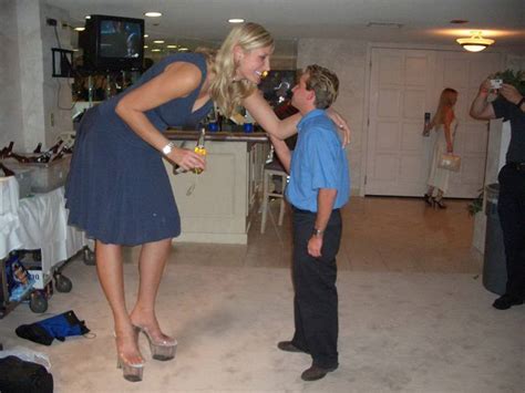 Tall Woman Talking To Short Man Drunk Tiki