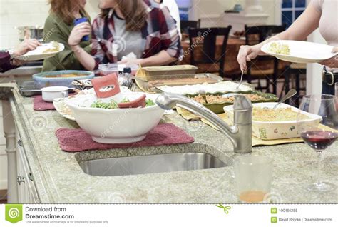 people serving  thanksgiving dinner stock image image