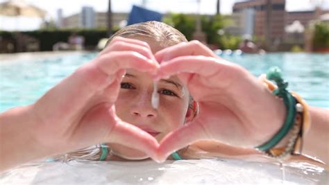 pre teen girl going underwater in the pool stock footage