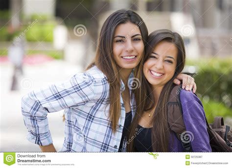 same sex mixed race couple on school campus stock image