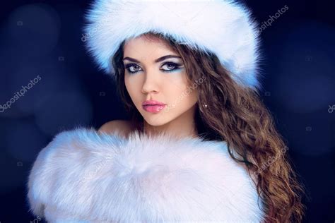 beautiful girl in fur coat and furry hat fashion model winter stock