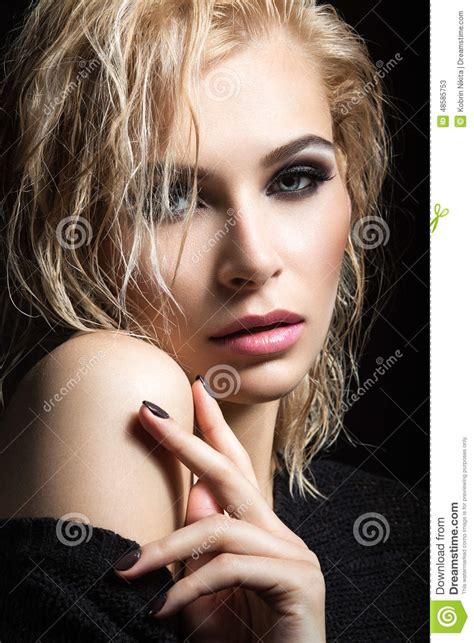 Beautiful Blond Girl With Wet Hair Dark Makeup And Pale