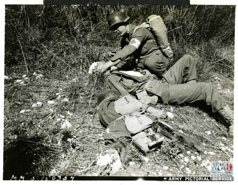 Medical Personnel Assisting Wounded American Soldier In