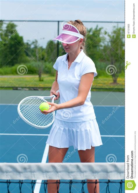 Tennis Player Holding Tennis Racket And Ball On The Tennis