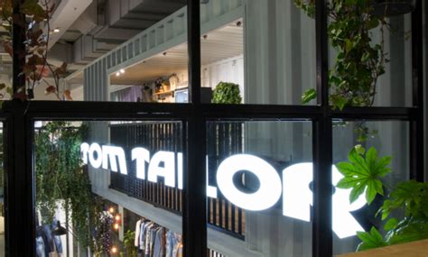 brands tom tailor group merges wholesale  retail divisions   roof