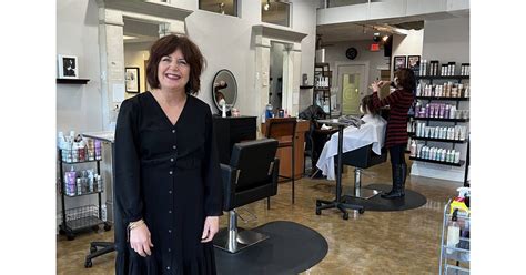 cutting hair   years guillotine salon spa celebrates milestone