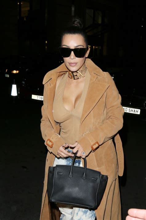Kim Kardashian Steps Out Wearing Necklace With The Word