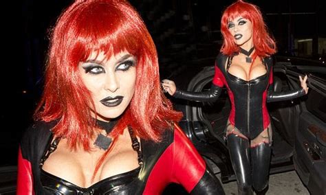 Carmen Electra Celebrates Halloween In Plunging Pvc