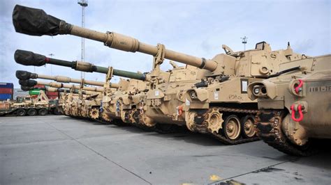 us army tanks arrive in poland as russia begins military