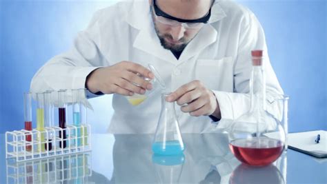 male scientist mixing chemicals  beaker stock footage video  shutterstock