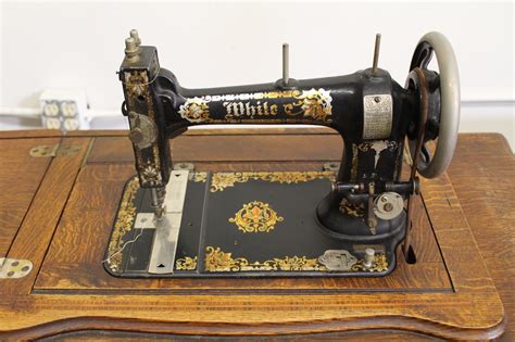 vintage white treadle sewing machine  cabinet ebth