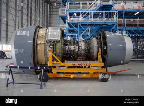 rolls royce trent  turbofan jet engine partially dismantled  undergoing maintenance stock