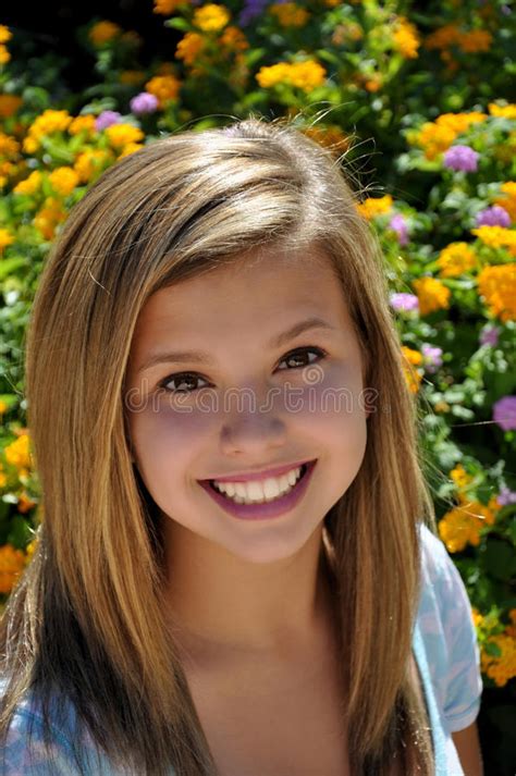pretty teen big smile next to flower garden royalty free stock images image 15920059