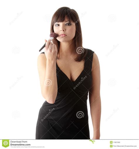 Woman In Elegant Black Dress Does A Make Up Stock Image