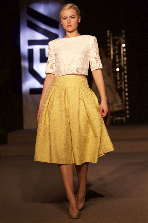 yellow brocade box pleat skirt  raised white backless top  tina griffin  collection