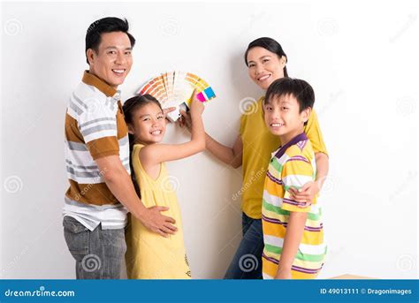 choosing color   walls stock image image  standing girl
